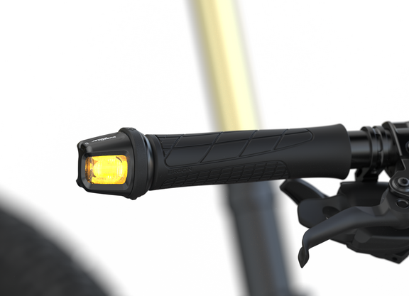 Blinker Titel Ein Fahrradblinker im Lenkerende.